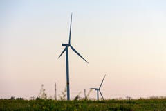 Wind turbines generating electricity on background of sky stock images Wind turbines generating electricity on background of sky stock images