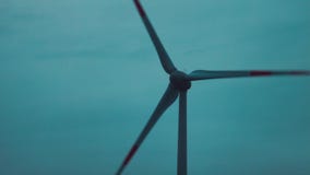 Windmills for electric power on sunset sky background. stock video Windmills for electric power on sunset sky background. stock video