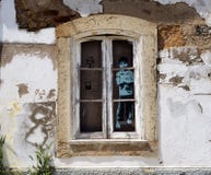 Window In Building In Lagos Portugal With Young Boy