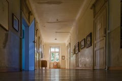 Big window at the end of a hallway in deserted colonial house stock photo Big window at the end of a hallway in deserted colonial house stock photo