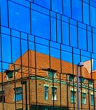 Windows Reflection Modern New Building And Old Vintage House Blue Glass And Stone Of Front House Wall Red Heart Royalty Free Stock Photos Windows Reflection Modern New Building And Old Vintage House Blue Glass And Stone Of Front House Wall Red Heart Royalty Free Stock Photos