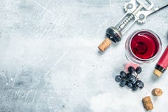 Wine background. A glass of red wine with grapes stock image Wine background. A glass of red wine with grapes stock image
