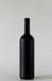 Wine black bottle are standing on gray background royalty free stock photography Wine black bottle are standing on gray background royalty free stock photography