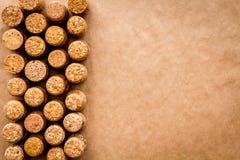 Wine bottle corks pattern on craft paper background top view copyspace. New Year celebration concept Stock Photo Wine bottle corks pattern on craft paper background top view copyspace. New Year celebration concept Stock Photo