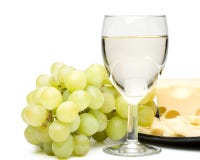 Wine In A Glass, Grapes And Cheese Stock Image