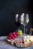 Wine snack set. Glass of red and white wine, grape, cheese, over royalty free stock photography Wine snack set. Glass of red and white wine, grape, cheese, over royalty free stock photography