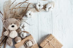 Winter Composition With Dry Plants, Gift Boxes And A Toy Bear On A Wooden Background. Template For A Greeting Card With Royalty Free Stock Image Winter Composition With Dry Plants, Gift Boxes And A Toy Bear On A Wooden Background. Template For A Greeting Card With Royalty Free Stock Image