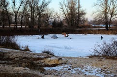 Winter fishing on a frozen river stock images Winter fishing on a frozen river stock images