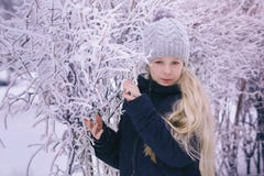 Winter girl blowing snow. Beauty Joyful Teenage Model Girl having fun in winter park. Beautiful girl laughing outdoors. Enjoying n Stock Photo Winter girl blowing snow. Beauty Joyful Teenage Model Girl having fun in winter park. Beautiful girl laughing outdoors. Enjoying n Stock Photo