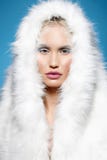 Winter girl in fur hood. halloween make-up stock photography Winter girl in fur hood. halloween make-up stock photography