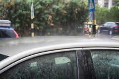Winter in Israel: Downpour, Heavy rain floods cars and road, raindrops on metal and glass stock photo Winter in Israel: Downpour, Heavy rain floods cars and road, raindrops on metal and glass stock photo