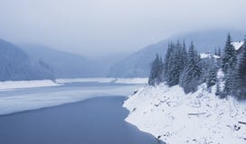Winter landscape with mountain lake