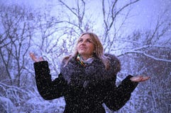 Winter portrait of a happy young woman walking in nature in the snow stock image Winter portrait of a happy young woman walking in nature in the snow stock image