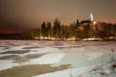 Winter scenery with frozen lake at night stock photo Winter scenery with frozen lake at night stock photo