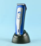 Wireless clipper stands at the charging station isolated on a pi stock images Wireless clipper stands at the charging station isolated on a pi stock images