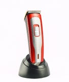 Wireless clipper stands on a charging station isolated on a white background. royalty free stock photography Wireless clipper stands on a charging station isolated on a white background. royalty free stock photography