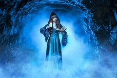 The witch with magic ball in her hands causes a spirits stock image The witch with magic ball in her hands causes a spirits stock image