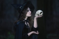 Witch with a skull Stock Photo Witch with a skull Stock Photo