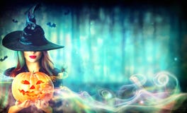 Witch With A Halloween Pumpkin Jack-o-lantern Royalty Free Stock Photo Witch With A Halloween Pumpkin Jack-o-lantern Royalty Free Stock Photo