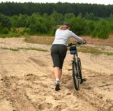 With Bike On The Tough Terrain Royalty Free Stock Images