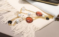 Woman accessories on a white scarf stock image Woman accessories on a white scarf stock image