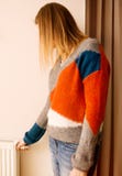Woman adjusting temperature of home heater. stock image Woman adjusting temperature of home heater. stock image