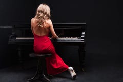 Woman And Piano Royalty Free Stock Image