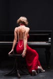 Woman And Piano Stock Images