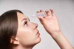Woman applying ophthalmology eyedropper. Glaucoma eye prevention. human vision serum wash. using disease contact eyedrop stock image Woman applying ophthalmology eyedropper. Glaucoma eye prevention. human vision serum wash. using disease contact eyedrop stock image