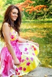 Woman with beautiful colorful dress near lake royalty free stock image Woman with beautiful colorful dress near lake royalty free stock image