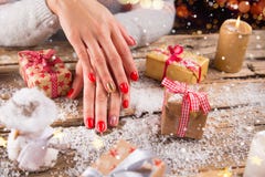 Woman with beautiful red nails on vintage wooden table royalty free stock image Woman with beautiful red nails on vintage wooden table royalty free stock image