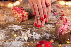 Woman with beautiful red nails on vintage wooden table stock photos Woman with beautiful red nails on vintage wooden table stock photos