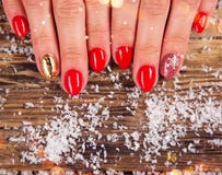 Woman with beautiful red nails on vintage wooden table stock photography Woman with beautiful red nails on vintage wooden table stock photography