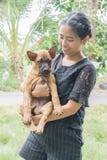 Woman beautiful young happy with thai ridgeback dog in the park hand holding small dog. royalty free stock photo Woman beautiful young happy with thai ridgeback dog in the park hand holding small dog. royalty free stock photo