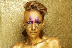 Woman gold face make up stock photos Woman gold face make up stock photos
