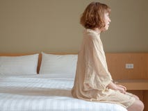 Woman and the bed stock photos Woman and the bed stock photos