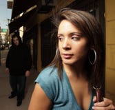Woman Being Stalked By A Thug Royalty Free Stock Image