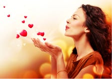 Woman Blowing Hearts from Hands Stock Photo Woman Blowing Hearts from Hands Stock Photo
