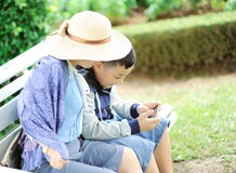 Woman With a Boy Sits on Bench Stock Image Woman With a Boy Sits on Bench Stock Image