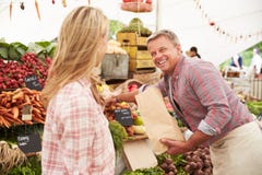 Woman Buying Fresh Vegetables At Farmers Market Stall Royalty Free Stock Photography Woman Buying Fresh Vegetables At Farmers Market Stall Royalty Free Stock Photography