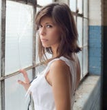 Woman By Window In Decaying Building Royalty Free Stock Photos