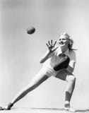 Woman catching a baseball