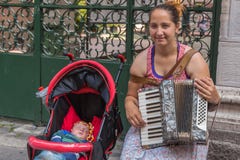 The woman with the child to make money stock photos The woman with the child to make money stock photos