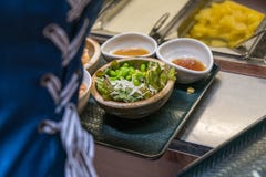 Woman choosing salad, vegetable in the buffet royalty free stock images Woman choosing salad, vegetable in the buffet royalty free stock images