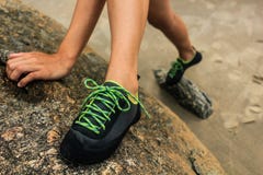 A woman climbing a rock wall stock images A woman climbing a rock wall stock images