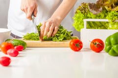 Woman Cooking Healthy Food, Cut Green Vegetable Salad. Healthy L Stock Photo