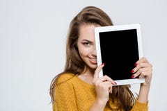 Woman covering half face with tablet computer stock image Woman covering half face with tablet computer stock image