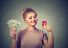 Woman with credit card and dollar cash happy with bank choice Stock Photos Woman with credit card and dollar cash happy with bank choice Stock Photos