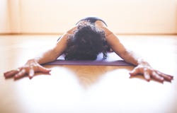 Woman doing yoga at wooden floor royalty free stock image Woman doing yoga at wooden floor royalty free stock image