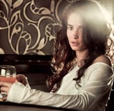 Woman Drinking Cocktail In Cafe Bar Stock Images